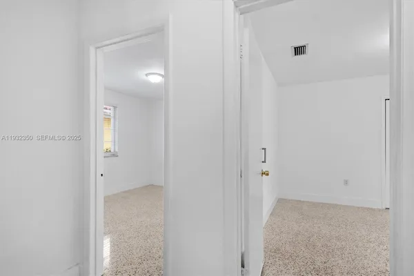 a bathroom with a granite countertop toilet a sink and shower