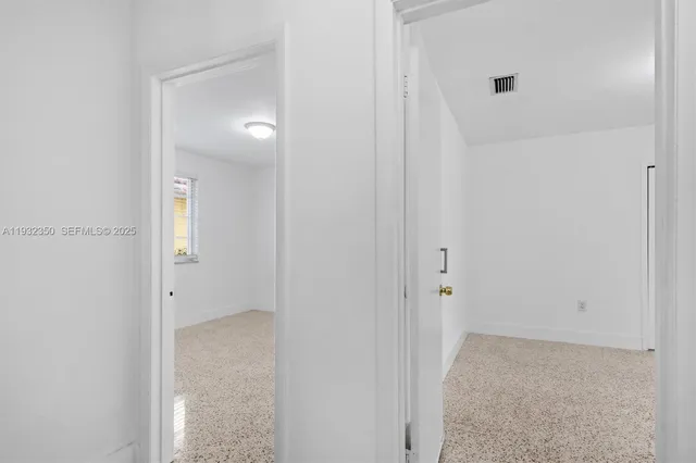 a bathroom with a granite countertop toilet a sink and shower