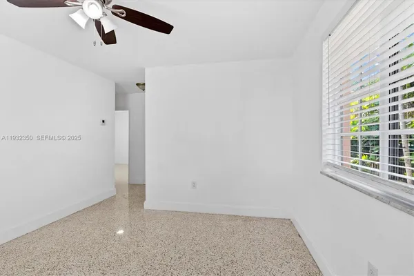 a kitchen with cabinets and white appliances