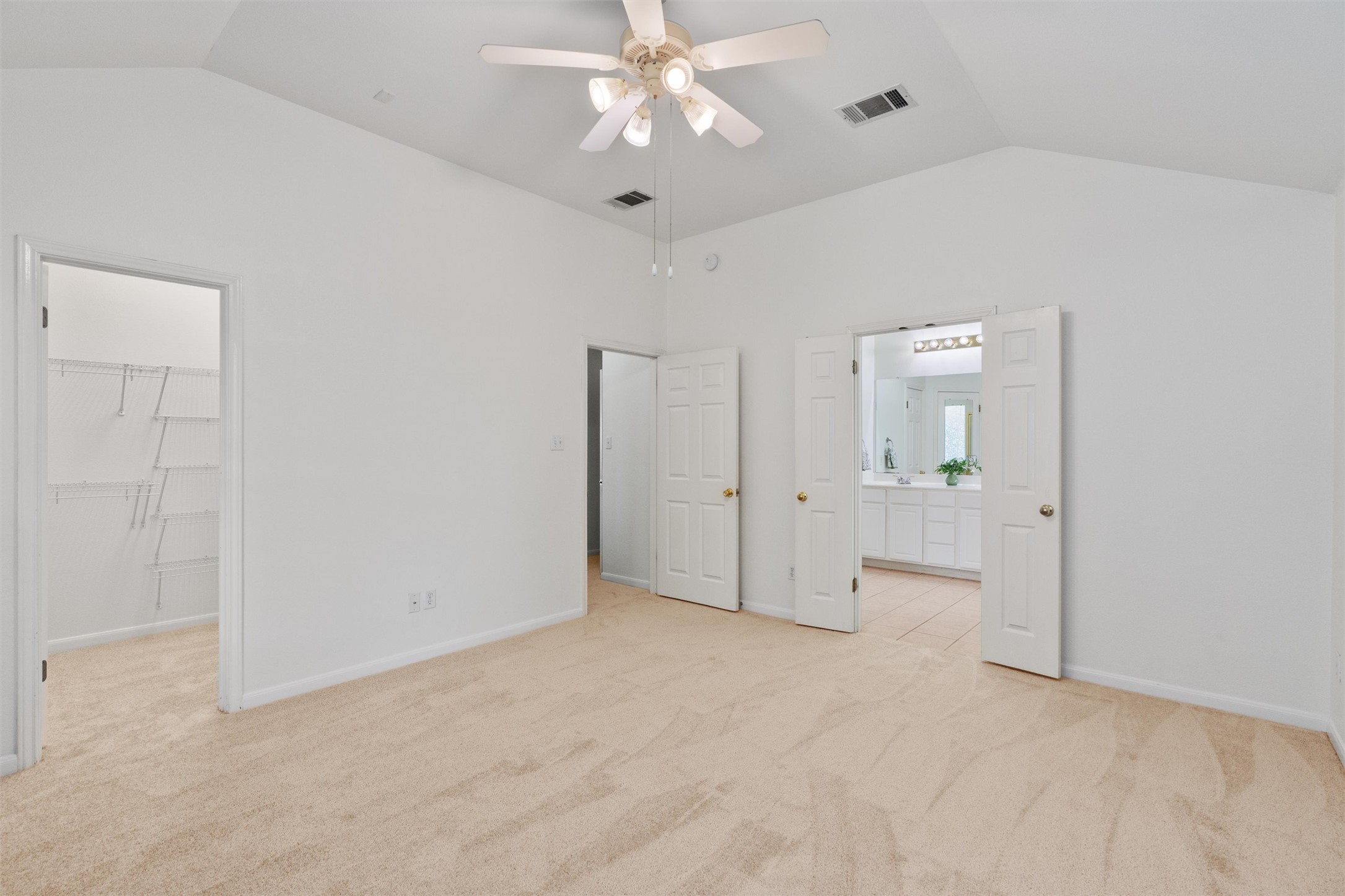 122 Copperwood Loop Round Rock, TX 78665 - Photo 13 of 40 This suite features a generous walk-in closet and high ceilings that add an airy sense of scale.