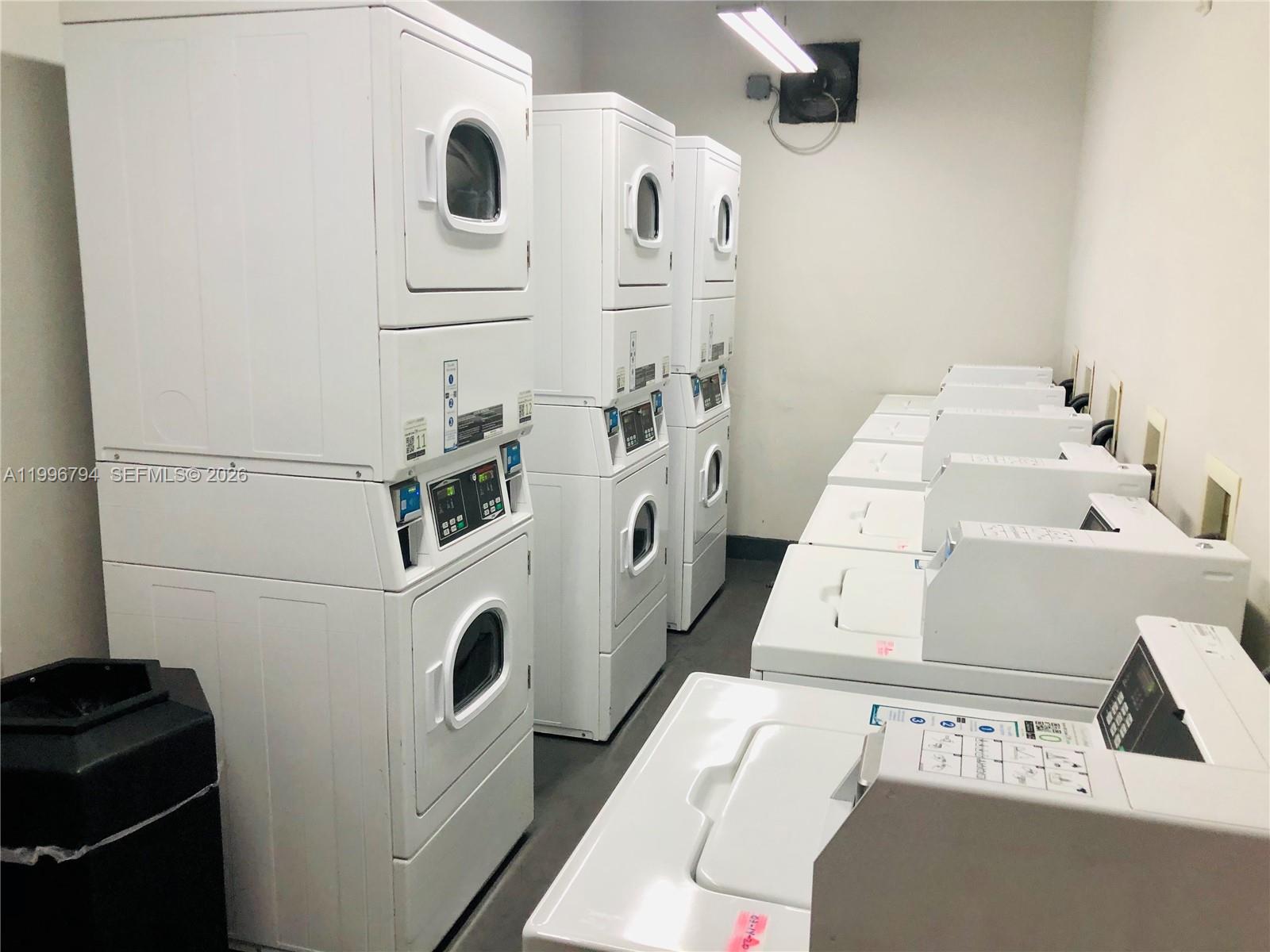 650 Northeast 64th Street, Unit G609 Miami, FL 33138 - Photo 15 of 15 a utility room with dryer and washer