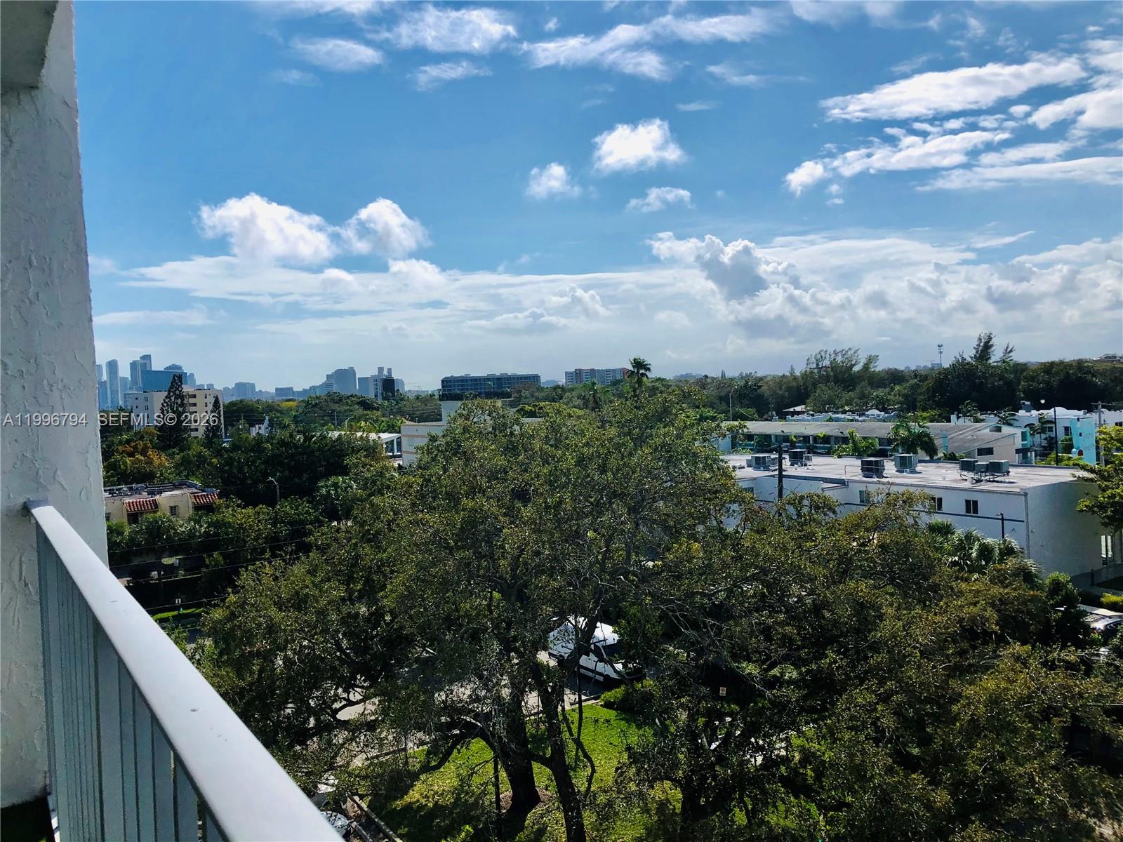 650 Northeast 64th Street, Unit G609 Miami, FL 33138 - Photo 2 of 15 a view of a lake from a balcony