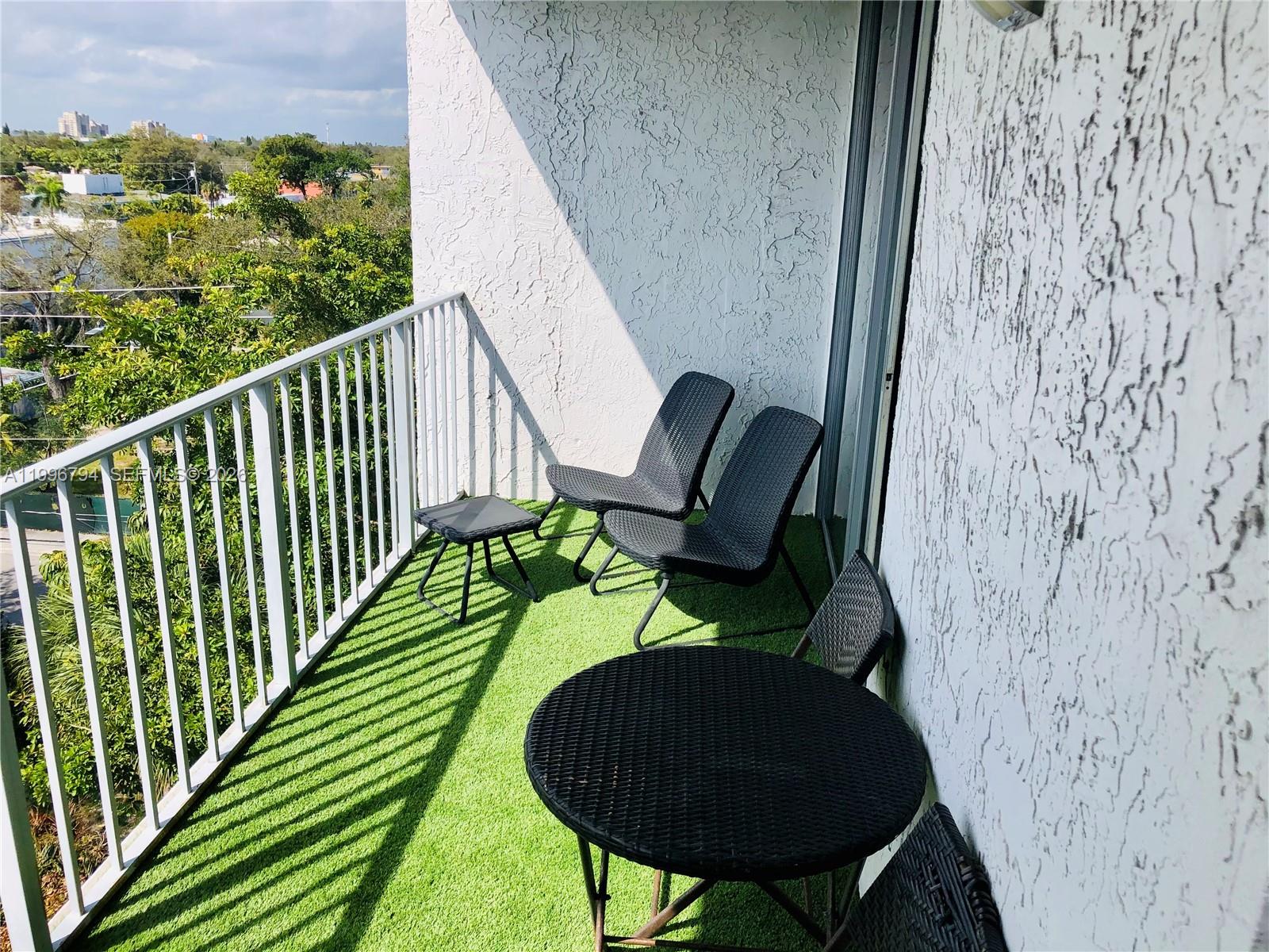 650 Northeast 64th Street, Unit G609 Miami, FL 33138 - Photo 3 of 15 a view of balcony with furniture
