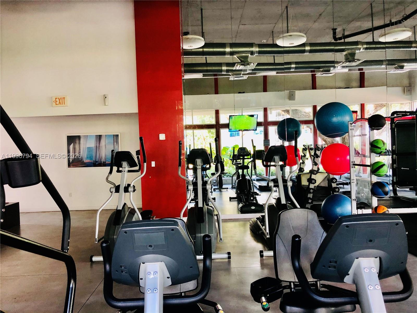 650 Northeast 64th Street, Unit G609 Miami, FL 33138 - Photo 9 of 15 a view of gym room