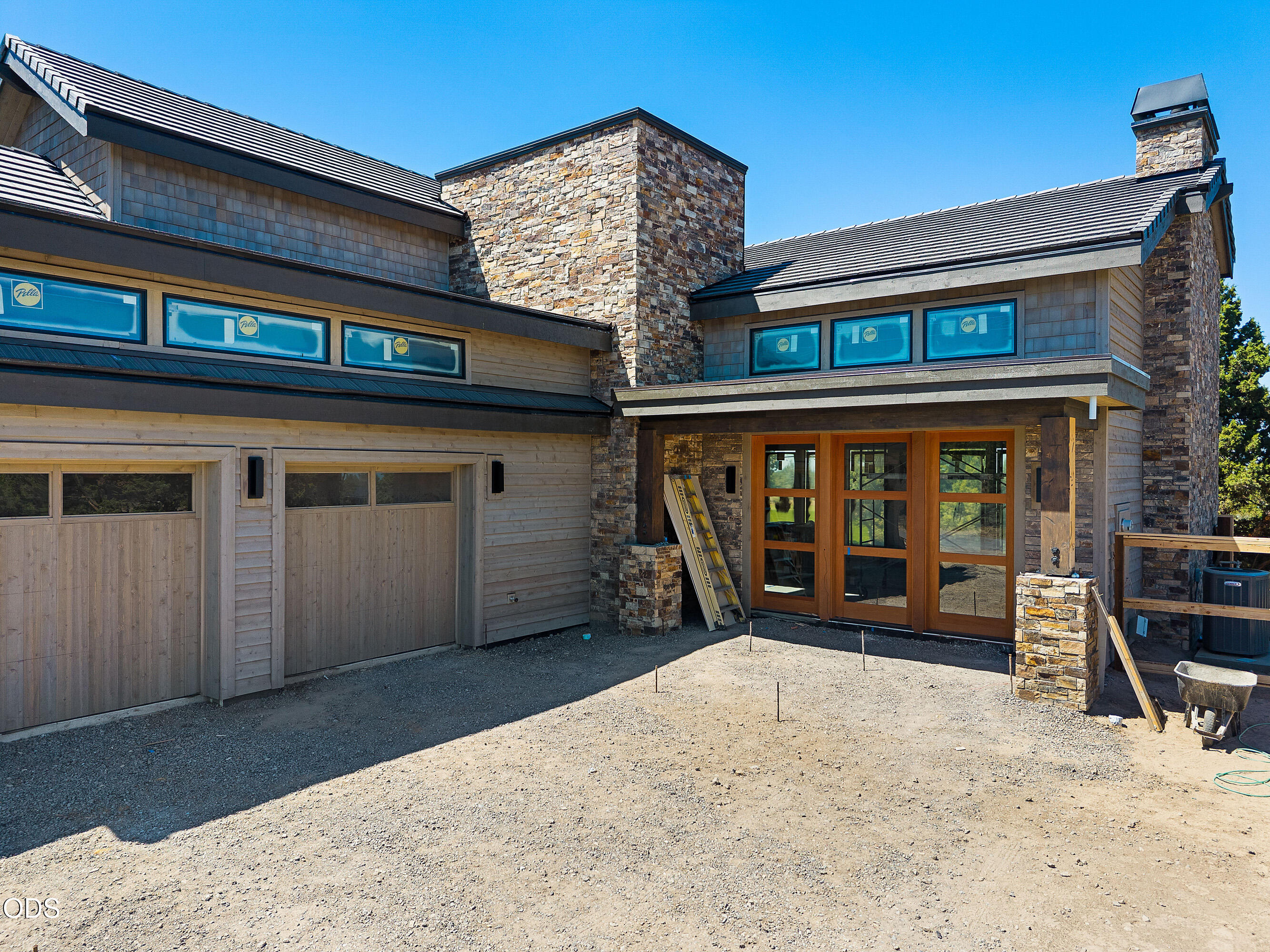 22936 Ghost Tree Lane Bend, OR 97701 - Photo 3 of 45 front view of a house with a large window and balcony