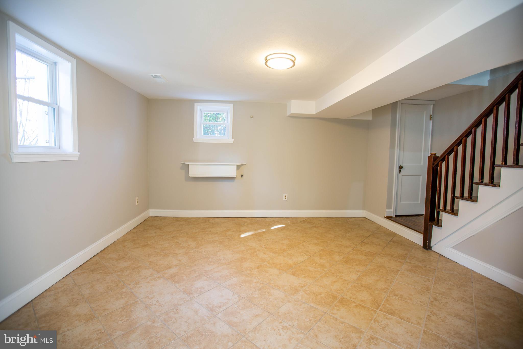 5035 West Hills Road Baltimore, MD 21229 - Photo 16 of 21 a view of an empty room with a window