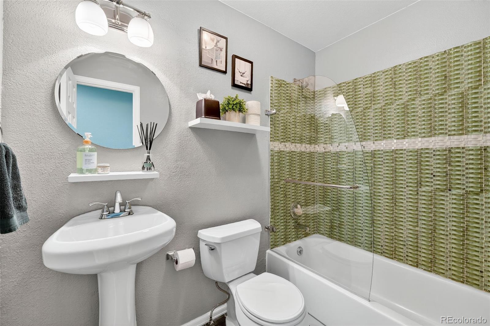 9910 Ashleigh Way Highlands Ranch, CO 80126 - Photo 20 of 49 a bathroom with a sink a toilet and shower