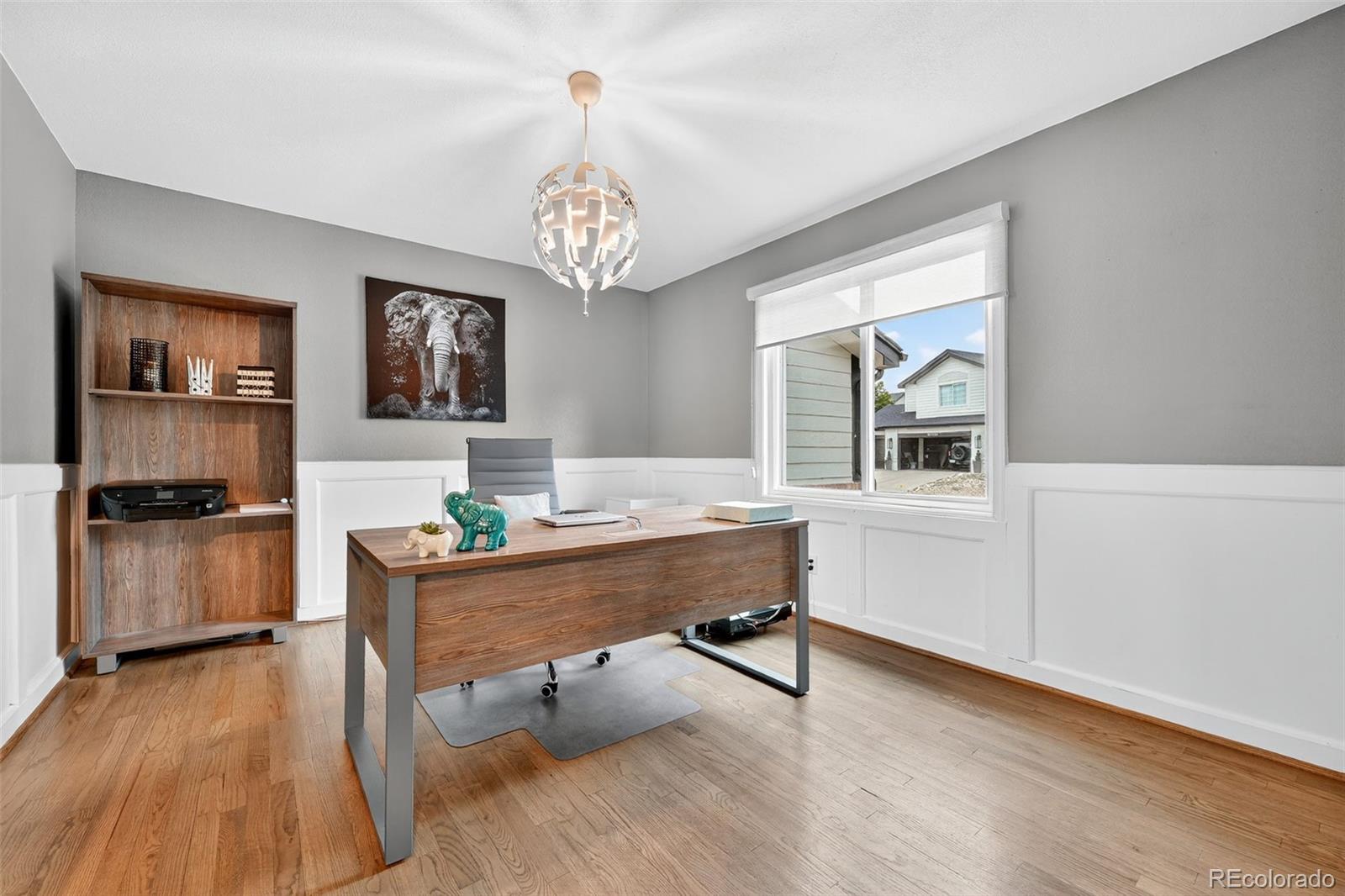 9910 Ashleigh Way Highlands Ranch, CO 80126 - Photo 22 of 49 a view of a workspace with furniture and a chandelier