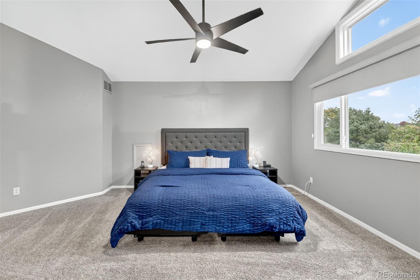 9910 Ashleigh Way Highlands Ranch, CO 80126 - Photo 24 of 49 a bedroom with a bed a window and a chandelier