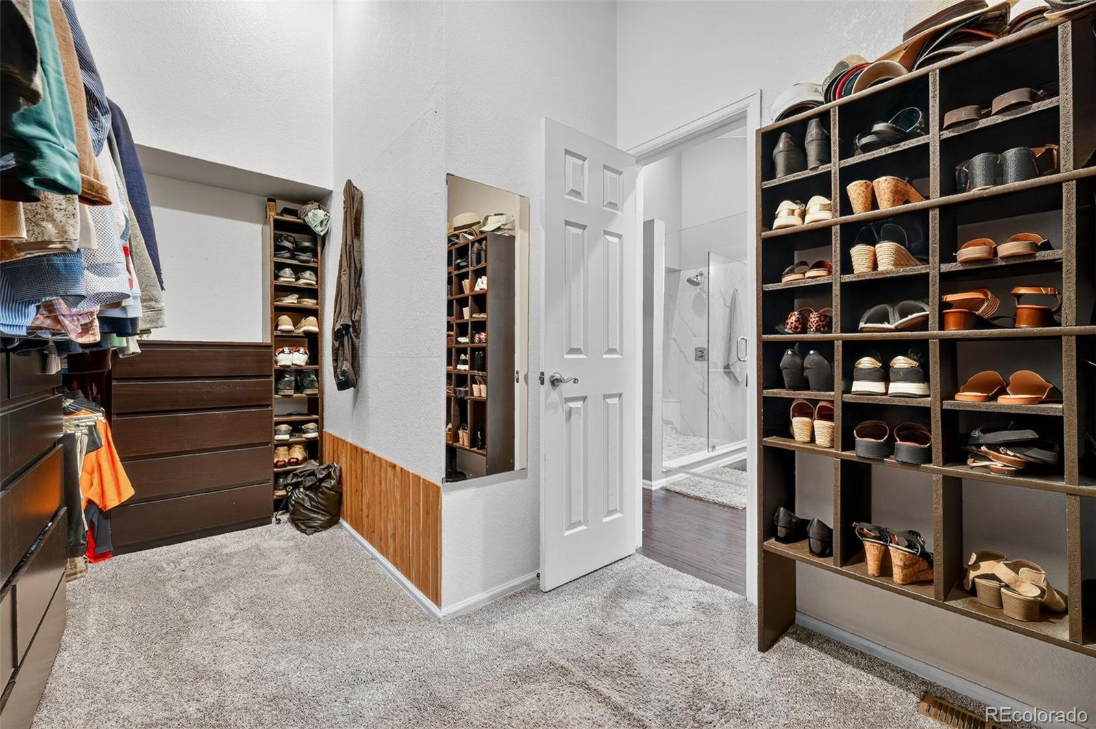 9910 Ashleigh Way Highlands Ranch, CO 80126 - Photo 25 of 49 a view of walk in closet with clothes and shoes