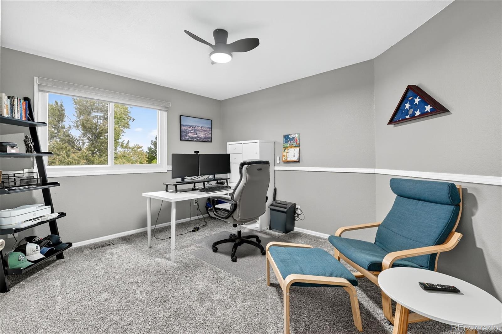 9910 Ashleigh Way Highlands Ranch, CO 80126 - Photo 28 of 49 a view of a workspace with furniture and a window