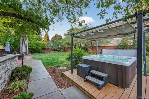 a view of a patio with table and chairs potted plants with wooden floor