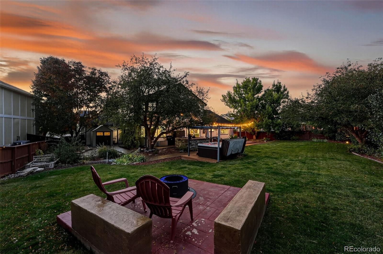 9910 Ashleigh Way Highlands Ranch, CO 80126 - Photo 40 of 49 a view of a yard with furniture and garden
