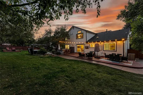 a view of a park with bench and trees
