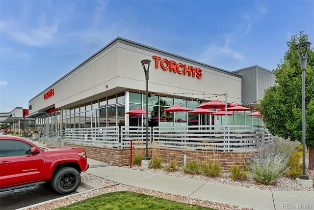 a front view of a building with parking space