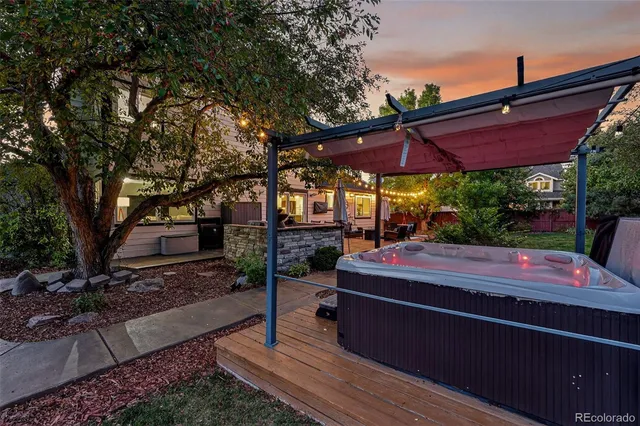 a view of a with table and chairs under an umbrella