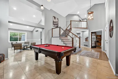 a room with lots of furniture and windows