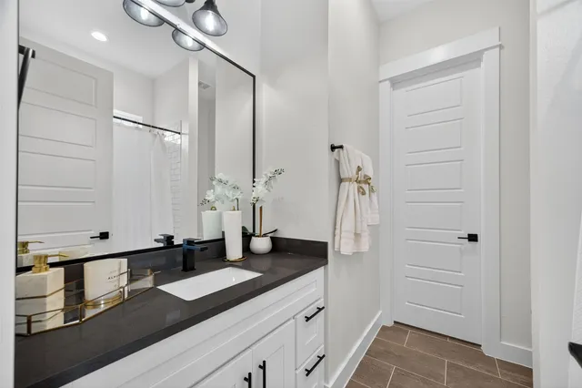 a bathroom with a sink and a mirror