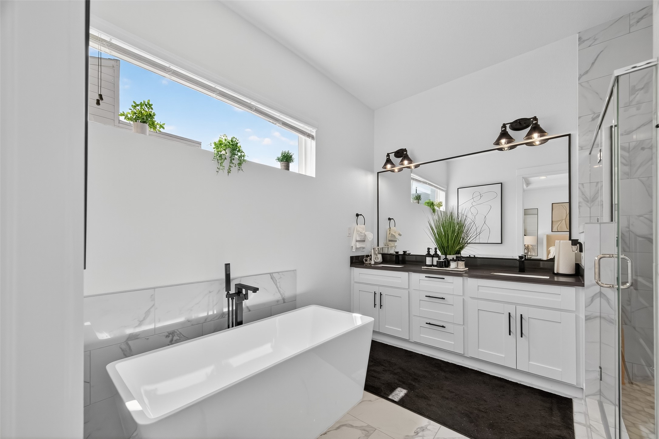 4806 Gano Street, Unit C Houston, TX 77009 - Photo 28 of 30 Primary bath - stand alone tub w/ walk-in shower. Matte black hardware