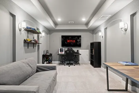 a living room with furniture and a large window