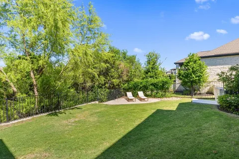 a view of a golf course with a tree
