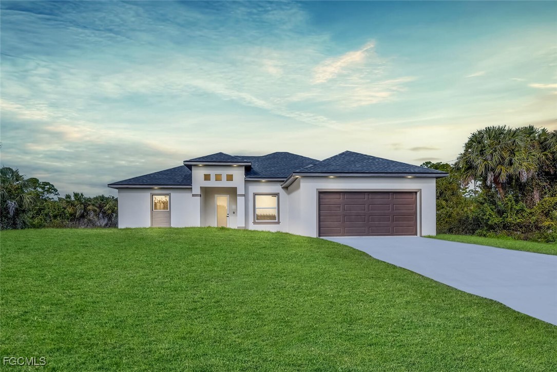 a view of a house with a yard