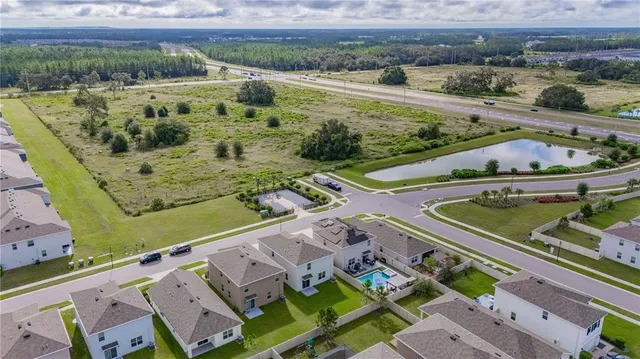 a view of a swimming pool with a yard