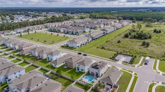 a view of a swimming pool with a yard