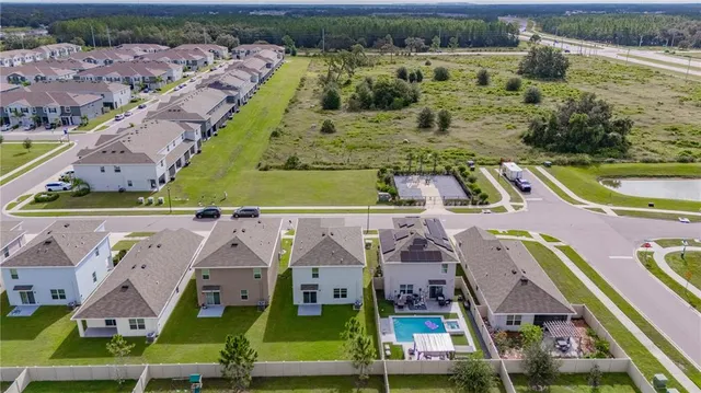 a front view of a house with a garden and garage
