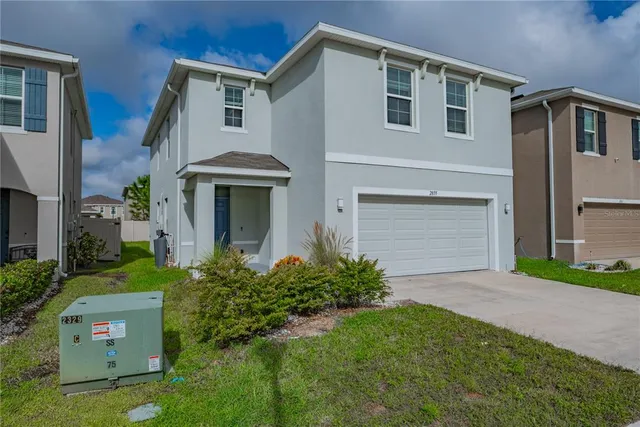 a view of a backyard with seating area