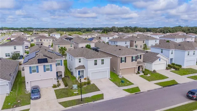 an aerial view of a house with a garden