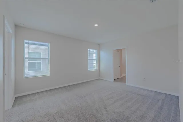 a bathroom with double sink and a mirror
