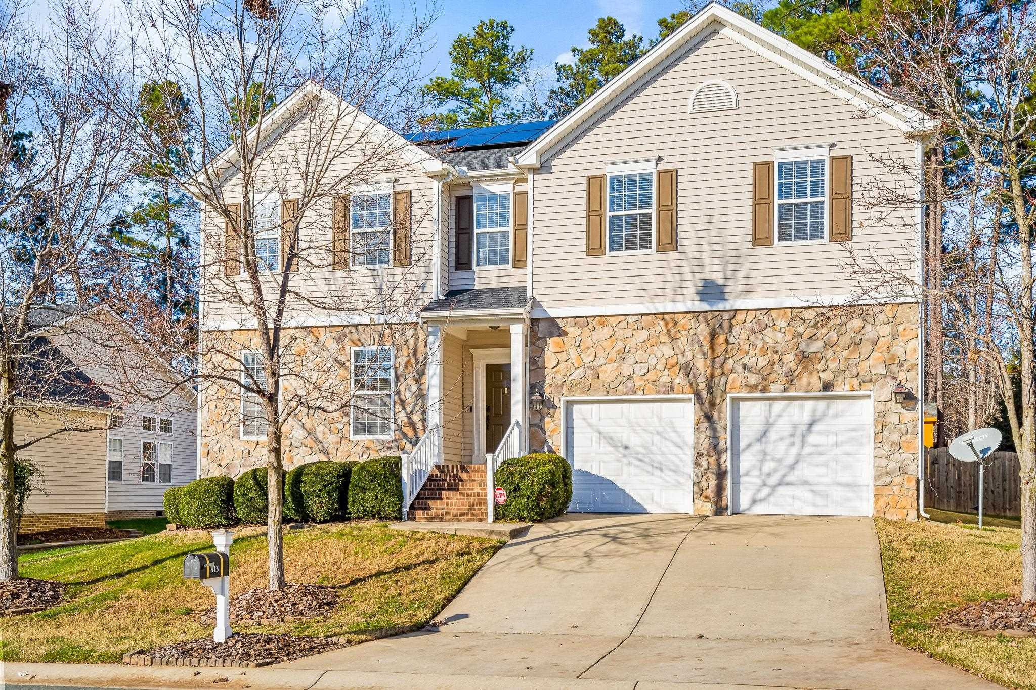 113 Whitney Lane Durham, NC 27713 - Photo 1 of 34 a view of a white house with large windows
