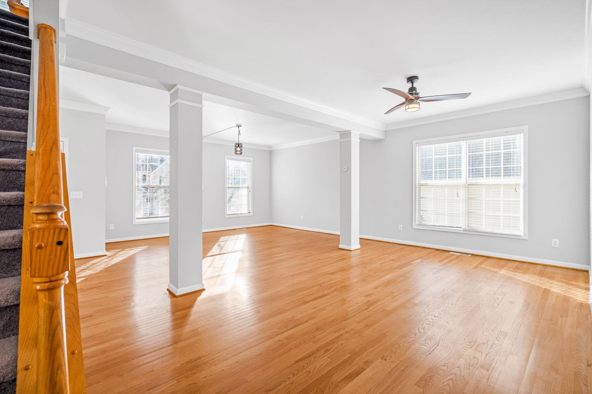 113 Whitney Lane Durham, NC 27713 - Photo 11 of 34 a view of an empty room with wooden floor and a window