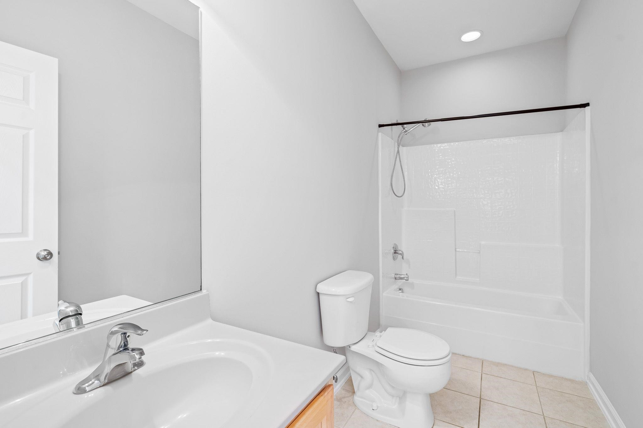 113 Whitney Lane Durham, NC 27713 - Photo 12 of 34 a bathroom with a sink toilet and shower