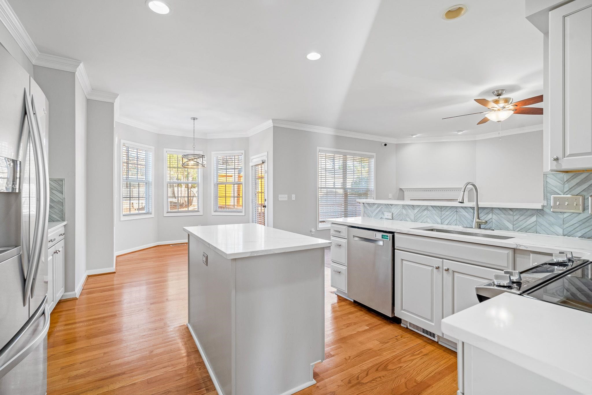 113 Whitney Lane Durham, NC 27713 - Photo 14 of 34 a kitchen with sink refrigerator and window