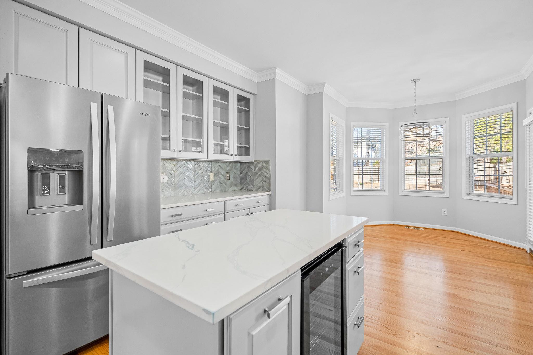 113 Whitney Lane Durham, NC 27713 - Photo 16 of 34 a kitchen with stainless steel appliances a refrigerator and a stove
