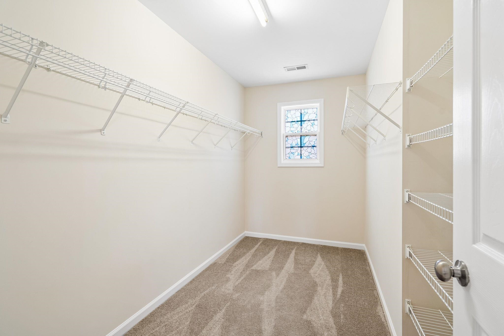 113 Whitney Lane Durham, NC 27713 - Photo 27 of 34 a view of a room with white walls and a window