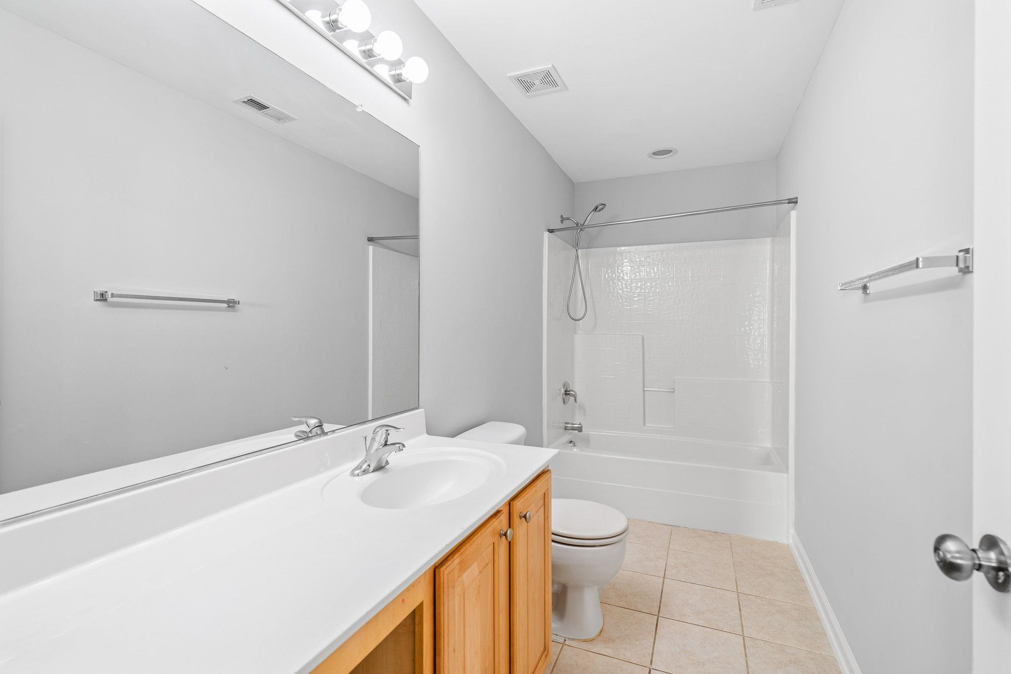 113 Whitney Lane Durham, NC 27713 - Photo 31 of 34 a bathroom with a sink a toilet and shower