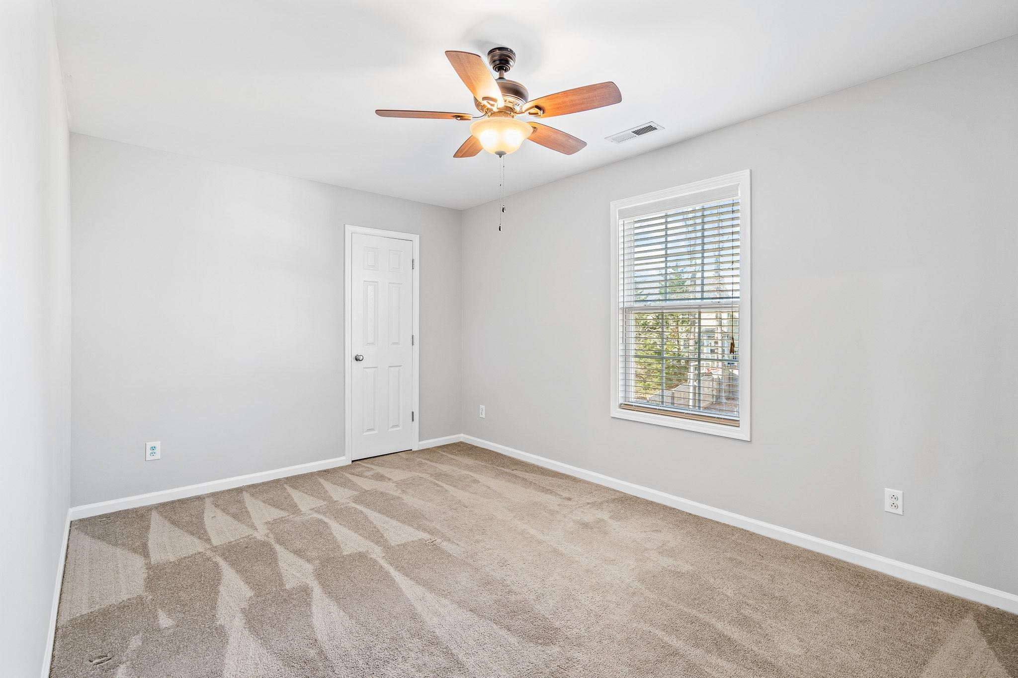 113 Whitney Lane Durham, NC 27713 - Photo 32 of 34 an empty room with ceiling fan and window
