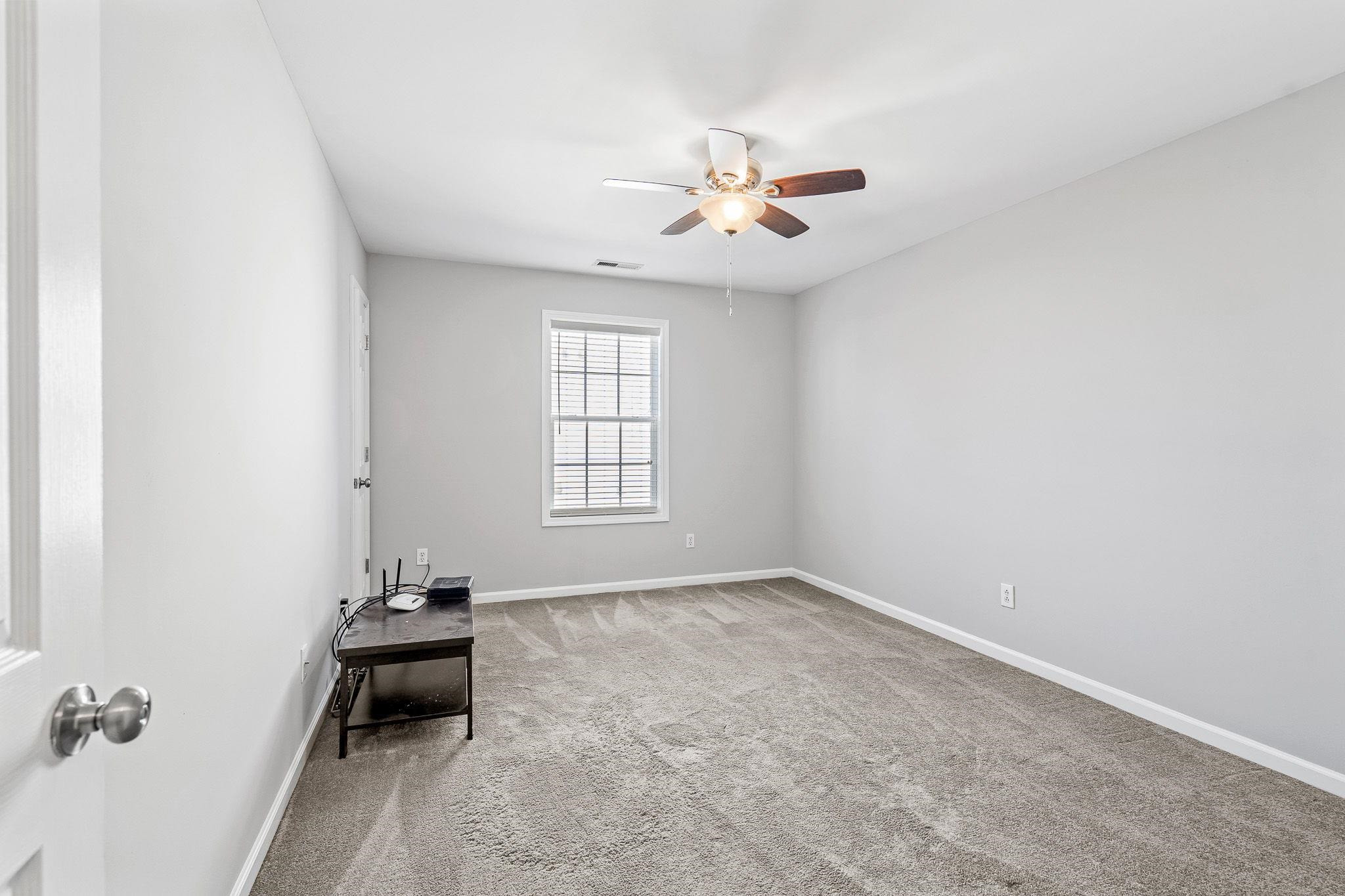 113 Whitney Lane Durham, NC 27713 - Photo 34 of 34 an empty room with windows and fan
