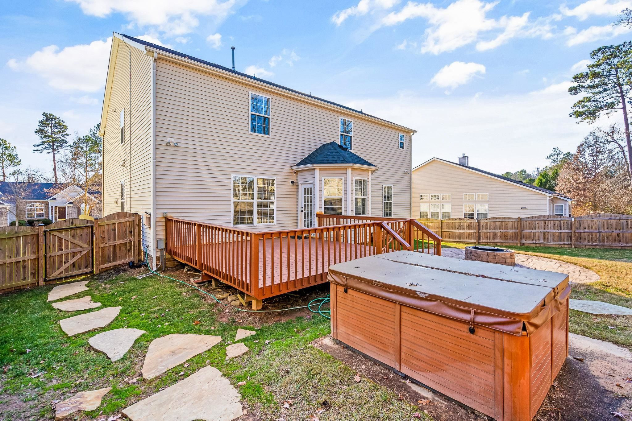 113 Whitney Lane Durham, NC 27713 - Photo 5 of 34 a view of a house with wooden deck and furniture