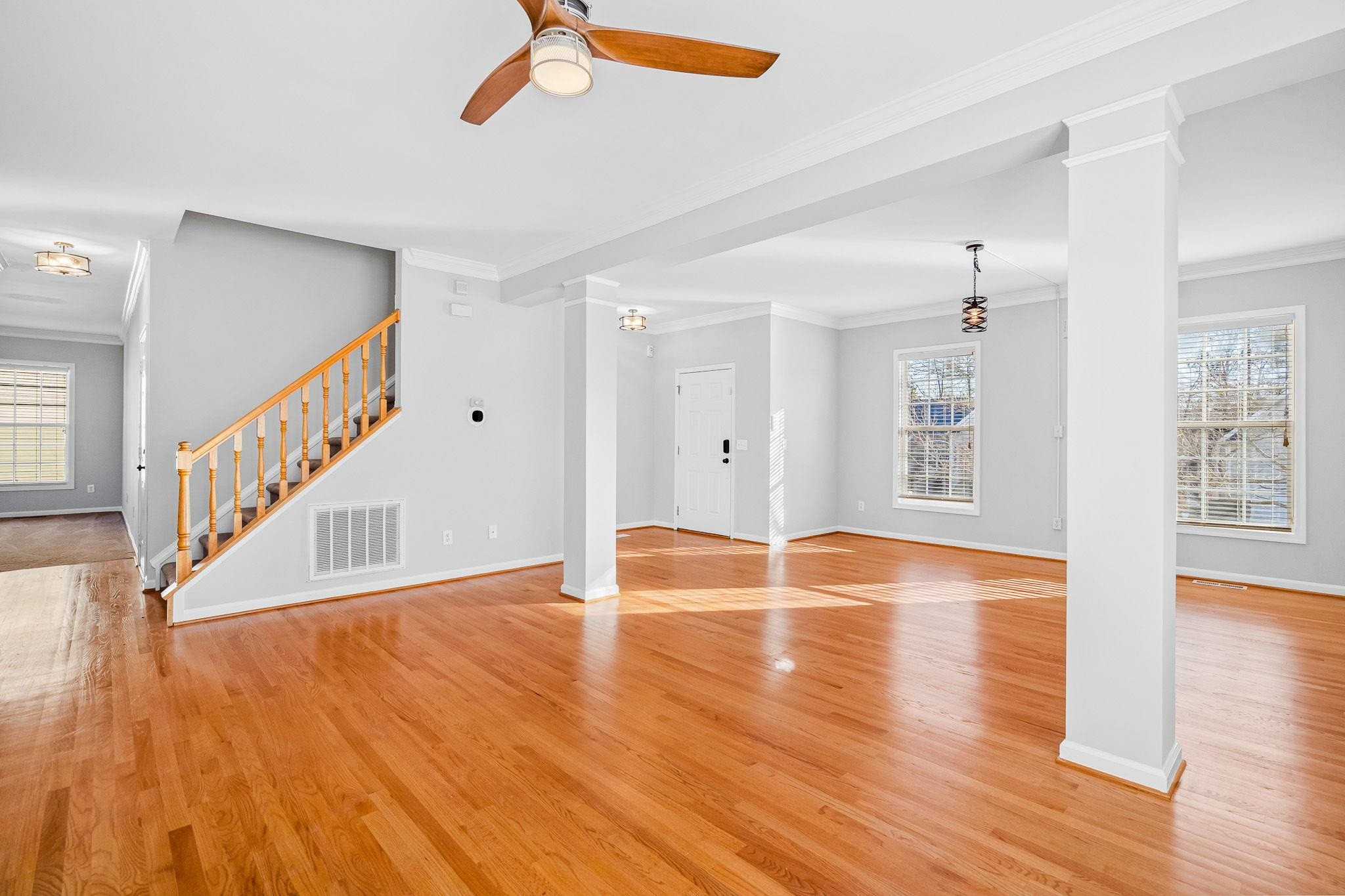 113 Whitney Lane Durham, NC 27713 - Photo 10 of 34 a view of an empty room with wooden floor and a window