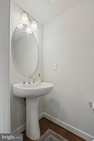 a bathroom with a sink and mirror
