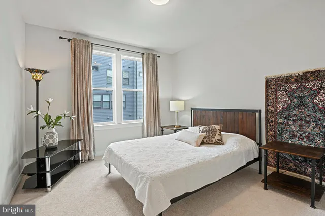 a picture of a bench in front of a wall