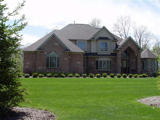 12822 Ashfield Road Caledonia, IL 61011 - Photo 1 of 7 a front view of a house with a yard