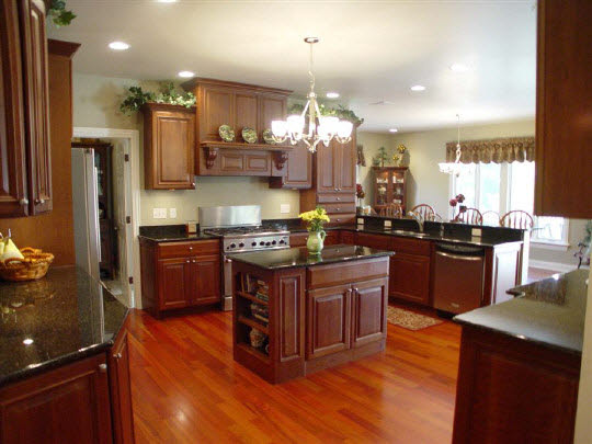 12822 Ashfield Road Caledonia, IL 61011 - Photo 4 of 7 a kitchen with stainless steel appliances granite countertop a stove a sink and a refrigerator