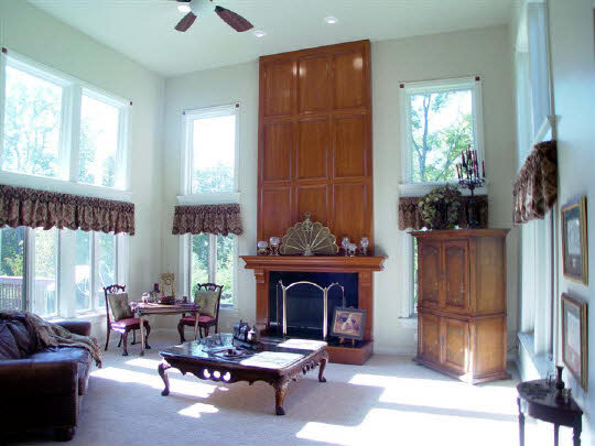 12822 Ashfield Road Caledonia, IL 61011 - Photo 5 of 7 a living room with furniture a window and a fireplace