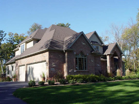 12822 Ashfield Road Caledonia, IL 61011 - Photo 6 of 7 front view of house with a yard