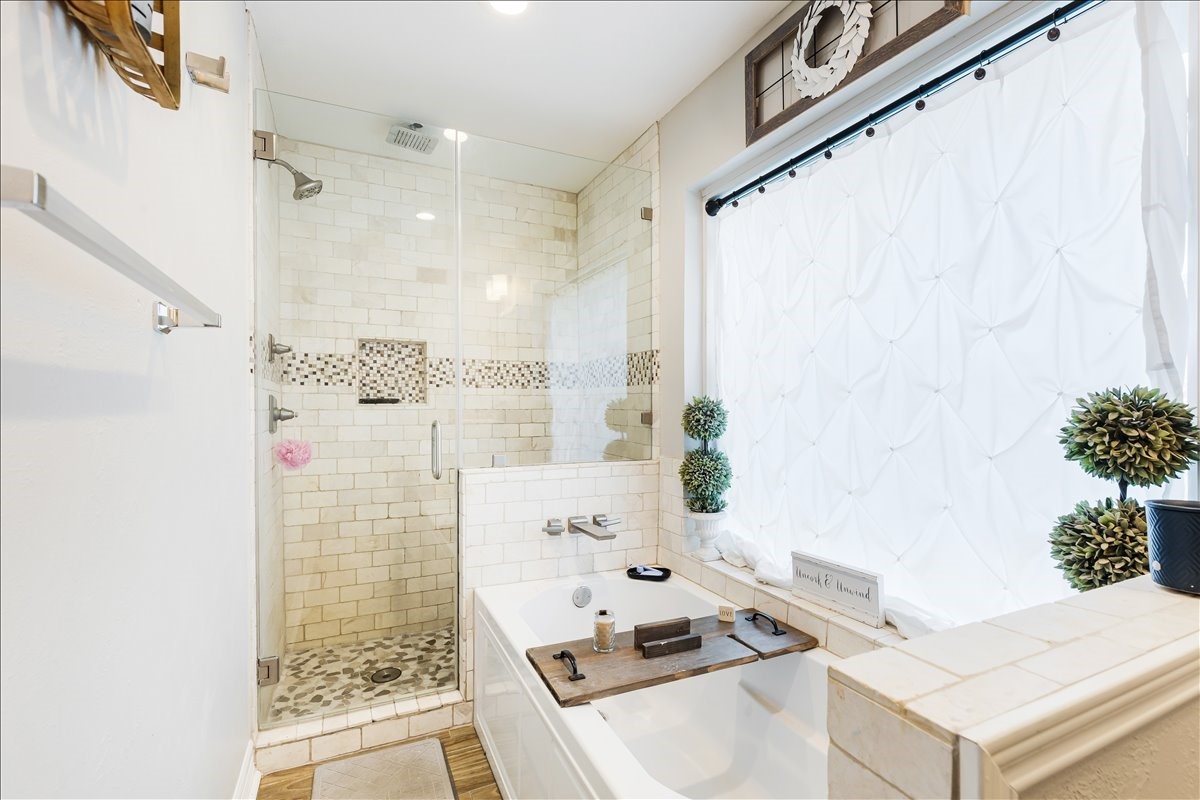 3809 Wingtail Way Pearland, TX 77584 - Photo 14 of 29 a bathroom with a sink a granite floor shower and a mirror